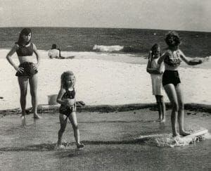 Vintage photo of beachgoers skim-boarding in Mexico Beach